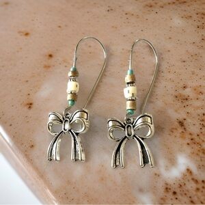 Ribbon Shaped Silver Tone Hoop Earrings